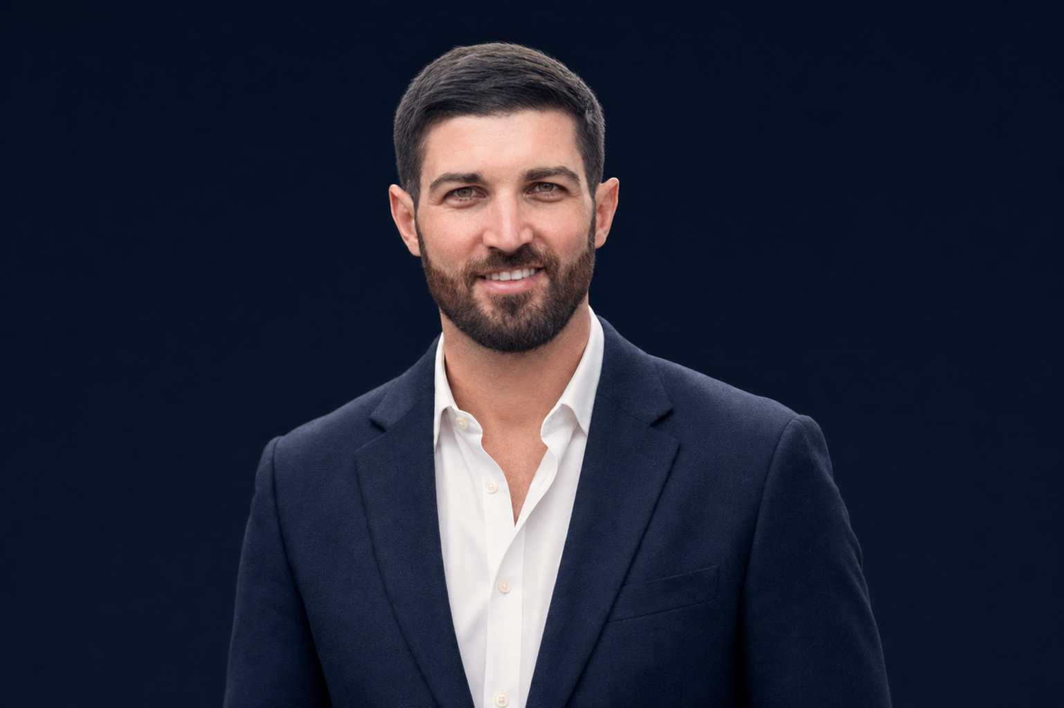Ashley Chalker in a navy suit and white shirt